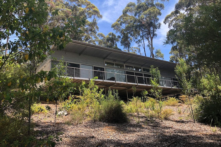 Front view of Karri Fire House, built in bushland on Wyman Trail, Ocean Beach at Denmark in Western Australia.