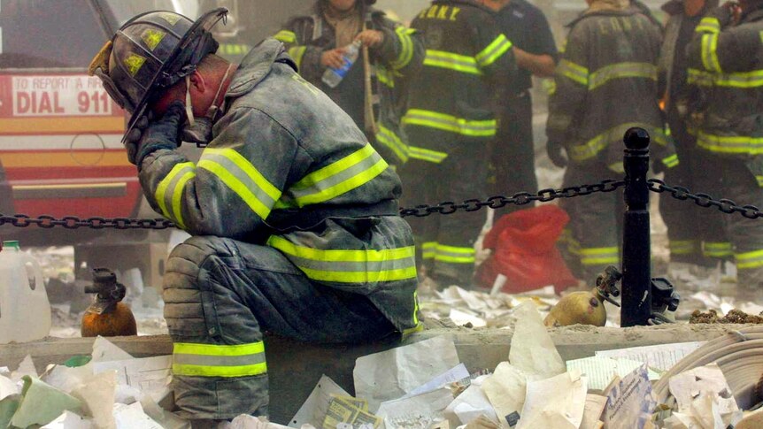 A firefighter breaks down after the World Trade Centre collapse