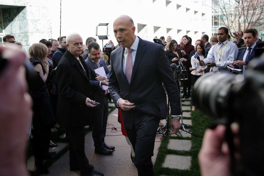 Peter Dutton leaves a large media pack