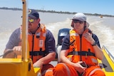 Two men in a boat.