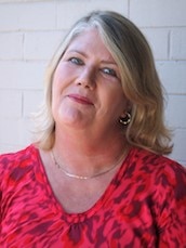 A headshot of Jennifer Weir, wearing a red top. 