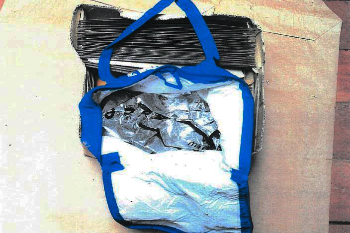 An aerial view of a blue and silver cooler bag sitting on a table.