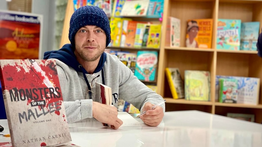 Man wearing a beanie at a book shop