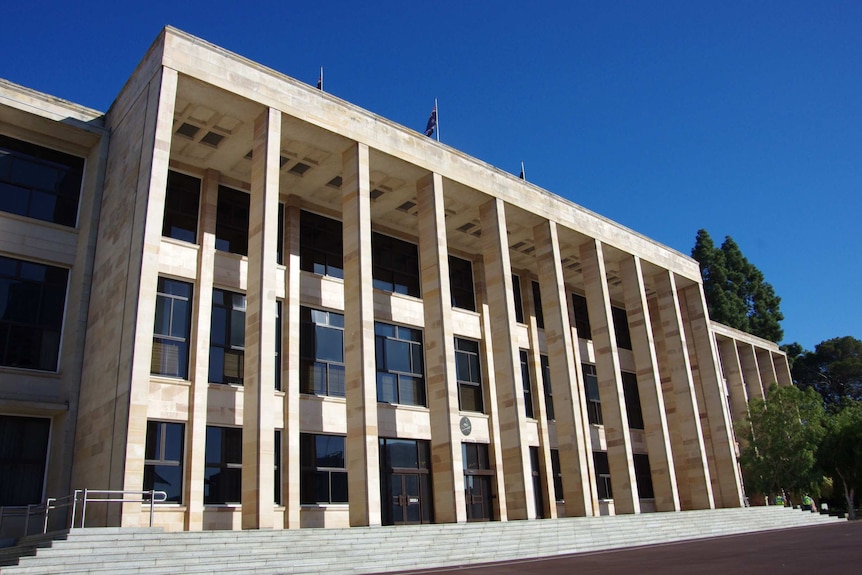 A wide shot of the front entrance of WA Parliament House.