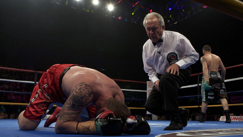 Paul Briggs gets the count after being felled by Danny Green during their bout