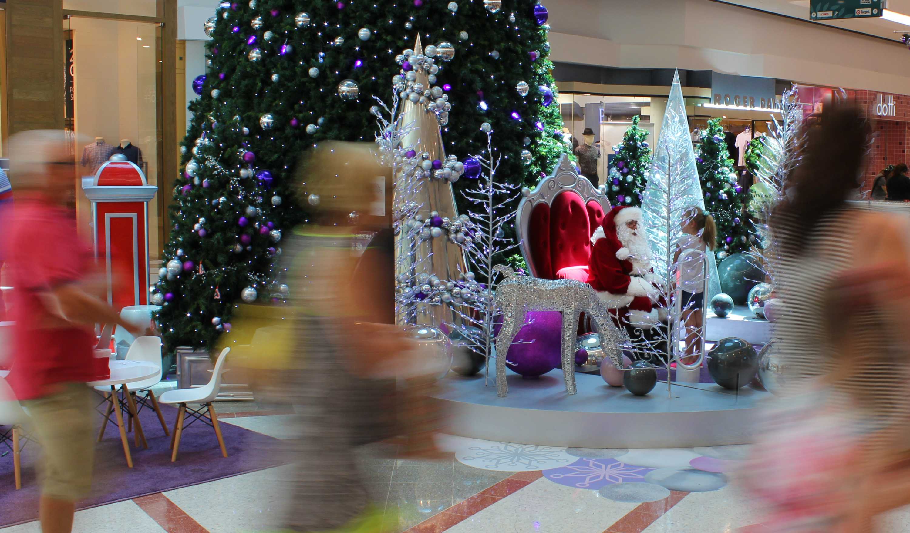 Shoppers walk past Santa in Grand Central Shopping Centre Toowoomba