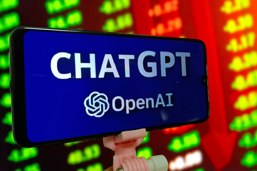 A phone displaying ChatGPT and OpenAI is held by a clip with a bright colourful screen inbackground