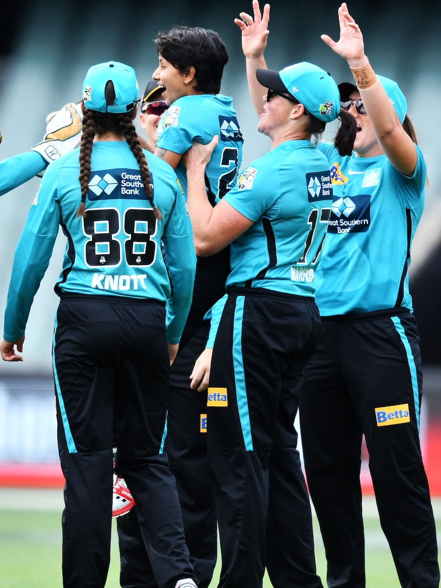 Grace Harris of the Brisbane Heat picks up Poonam Yadav after she takes a wicket