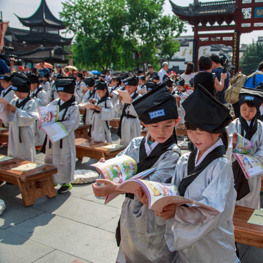 Pupils in traditional costumes at a ceremony at the Confucius Temple on August 31, 2016 in Nanjing, Jiangsu Province of China.