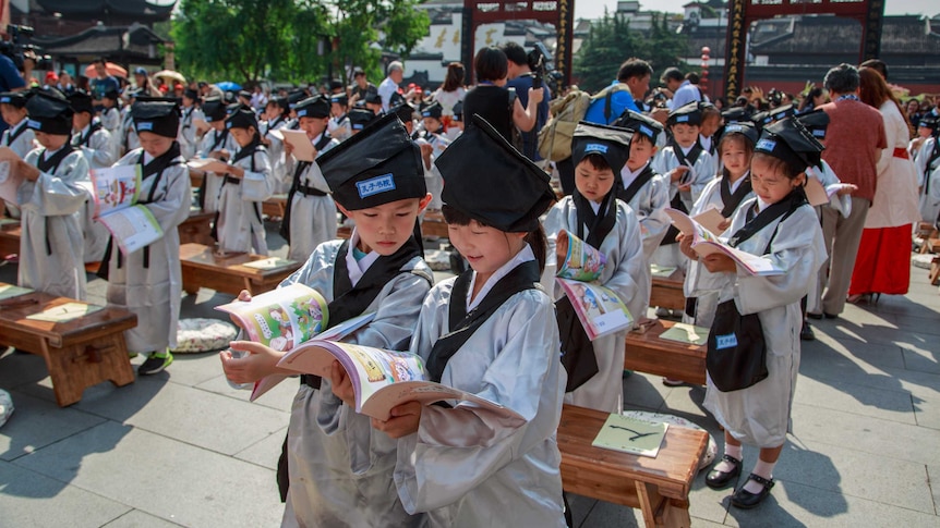 Pupils in traditional costumes at a ceremony at the Confucius Temple on August 31, 2016 in Nanjing, Jiangsu Province of China.