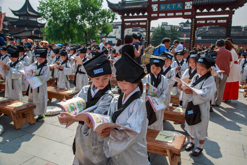 Pupils in traditional costumes at a ceremony at the Confucius Temple on August 31, 2016 in Nanjing, Jiangsu Province of China.