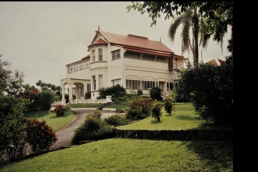 The white heritage-listed colonial-style Boothville Mothers Home stands tall on a grassy hill in Windsor, Brisbane