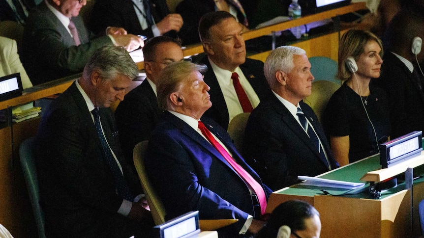 President Donald Trump listens with headphones during the the United Nations Climate Action Summit during the General Assembly.