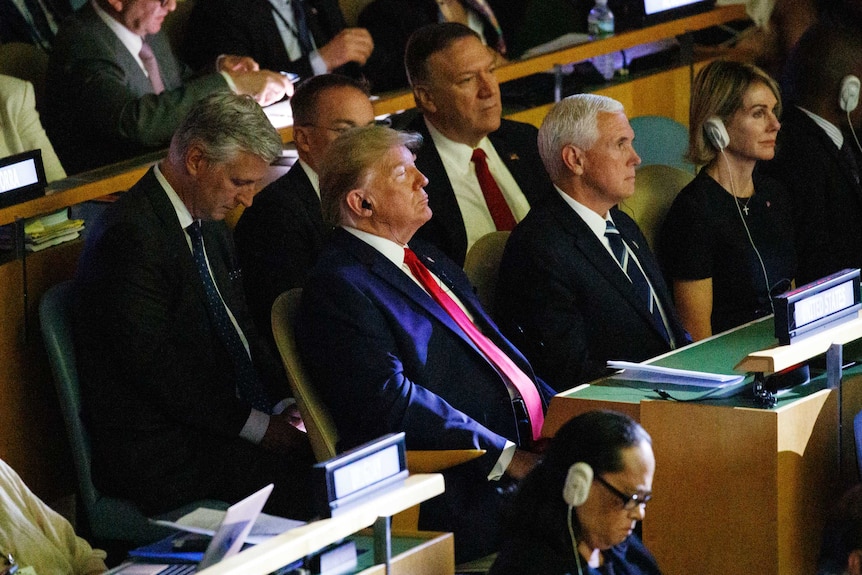 President Donald Trump listens with headphones during the the United Nations Climate Action Summit during the General Assembly.