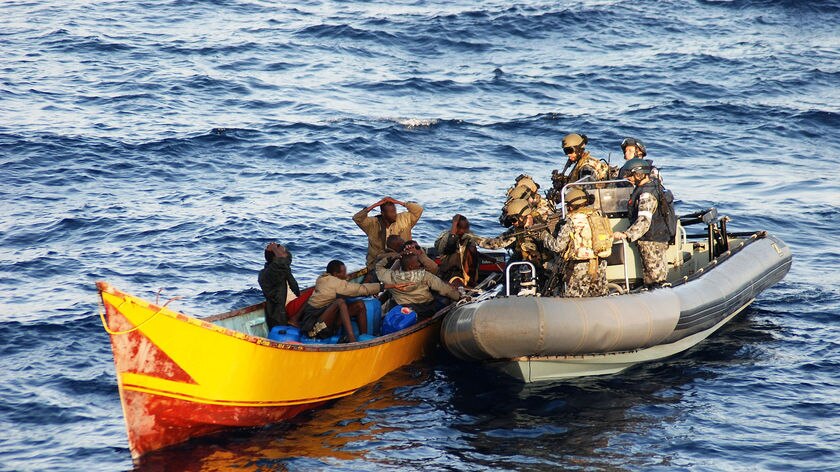 A boarding party from HMAS Toowoomba searches a pirate boat on September 23, 2009.