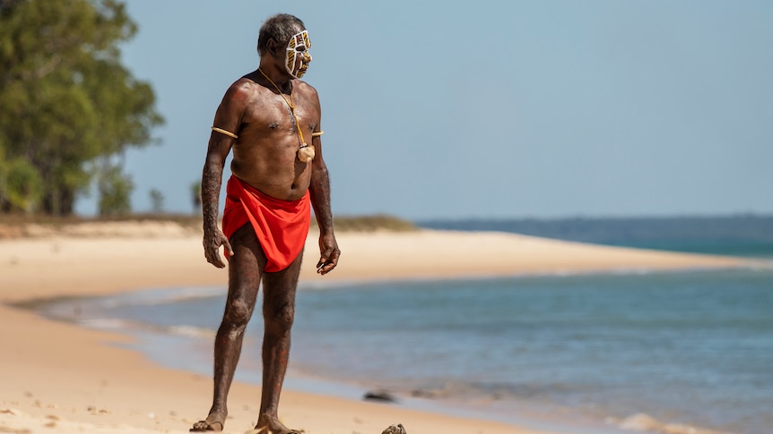 Pirrawayingi Puruntatameri stands on a beach.