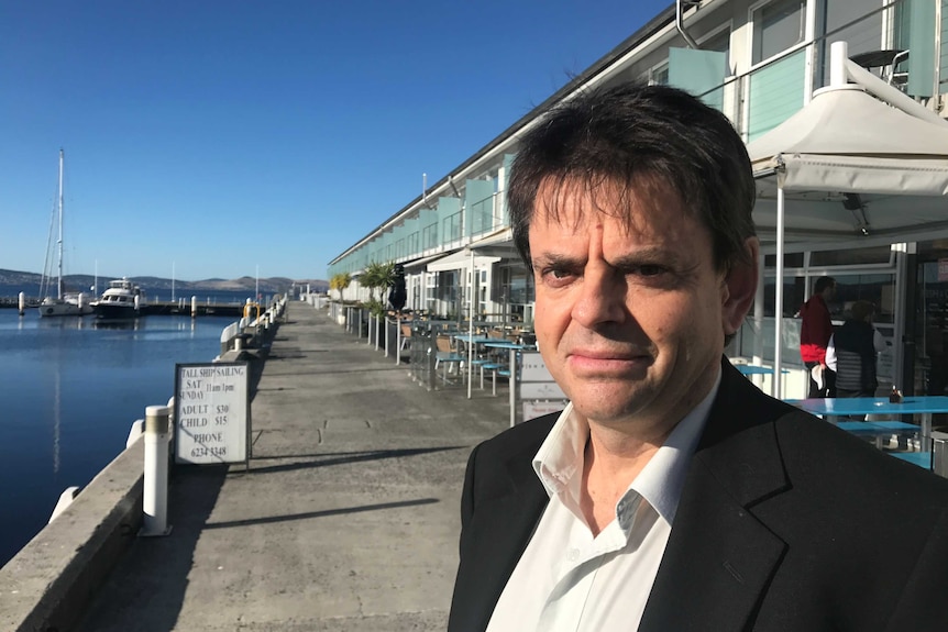 Hobart City Council Alderman Philip Cocker stands on Franklin Wharf