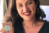 Rachel Shearer smiling and holding a bar of soap in her hand