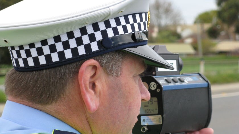 Tasmanian police officer with speed gun (file photo)