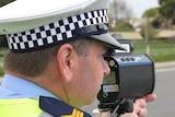 Tasmanian police officer with speed gun