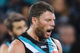Brad Ebert pumps his best as he celebrates a goal for Port Adelaide against North Melbourne.