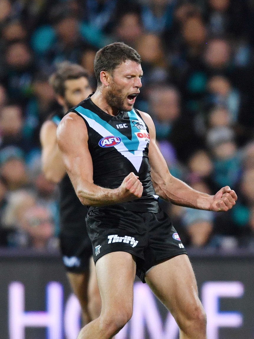 Brad Ebert pumps his best as he celebrates a goal for Port Adelaide against North Melbourne.