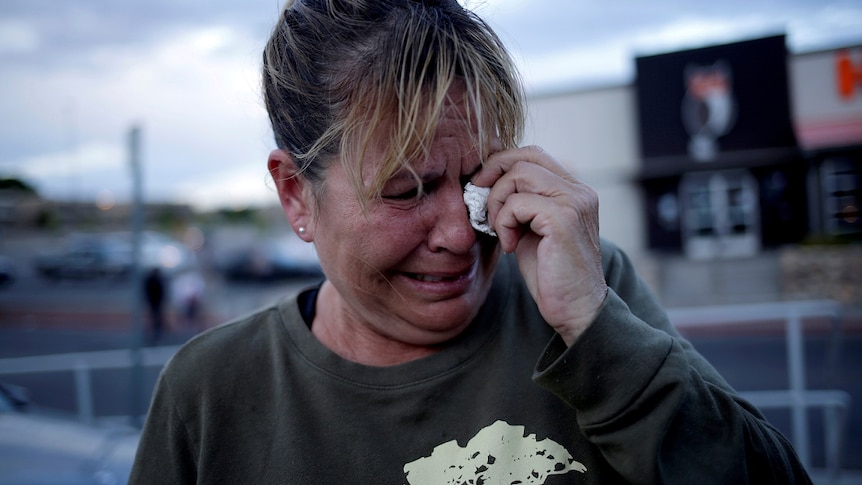 A woman reacts after a mass shooting at a Walmart in El Paso, Texas, US August 3, 2019.
