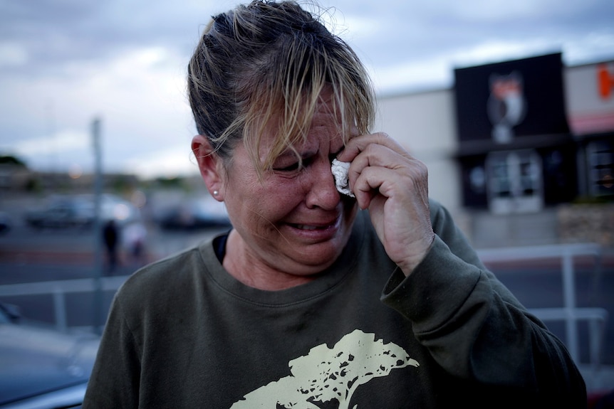 A woman reacts after a mass shooting at a Walmart in El Paso, Texas, US August 3, 2019.