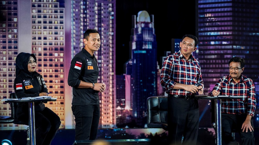 Candidate Agus Harimurti Yudhoyono (L) and Basuki Tjahaja Purnama (R) during the live televised debate.