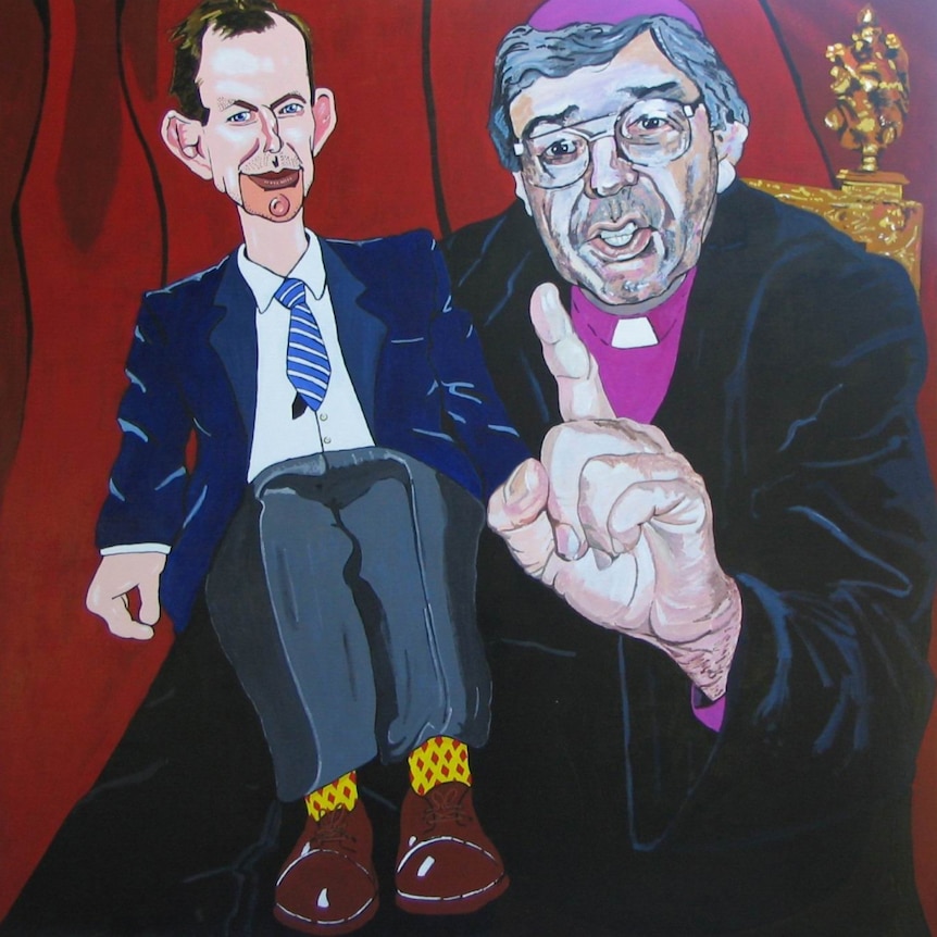 A painting of Cardinal George Pell with Tony Abbott seated on his lap, as if he is a ventriloquist with a doll.