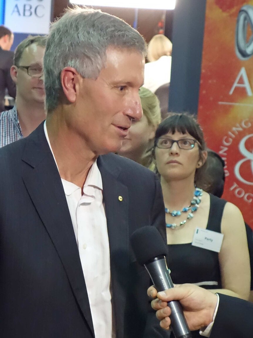 Portrait photo: ANU Professor John Warhurst being interviewed on ACT election night in the tally room. 20 October 2012.