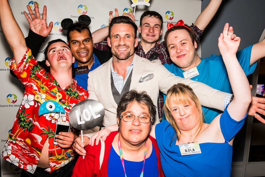 Jonathan Hopkirk surrounded by guests at Dance For Abilities