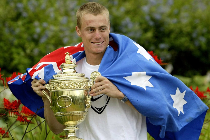 Lleyton Hewitt poses with the Wimbledon trophy in 2002