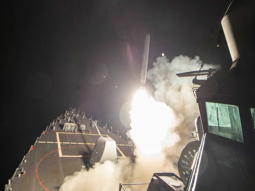US Navy guided-missile destroyer USS Ross (DDG 71) fires a tomahawk land attack missile in Mediterranean Sea.