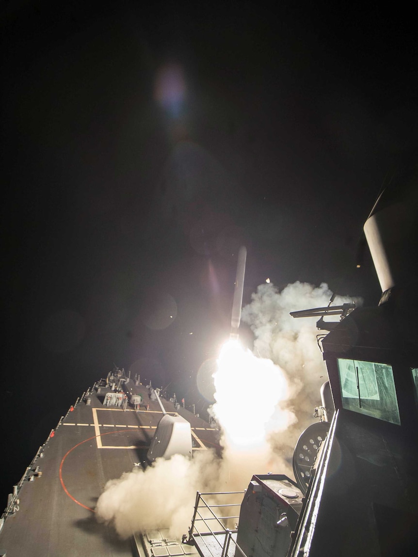 US Navy guided-missile destroyer USS Ross (DDG 71) fires a tomahawk land attack missile in Mediterranean Sea.
