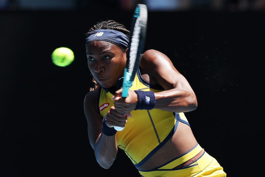 Coco Gauff plays a doubled-fisted backhand at the 2024 Australian Open.