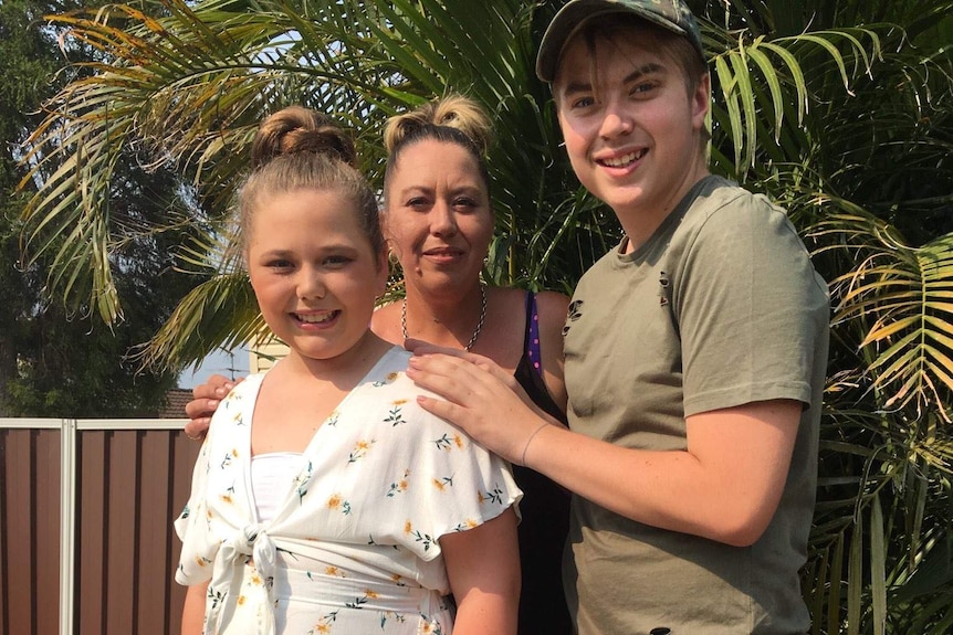 Kristie Archer (centre) posing for a photo with daughter Eden (left) and son Bodie (right)