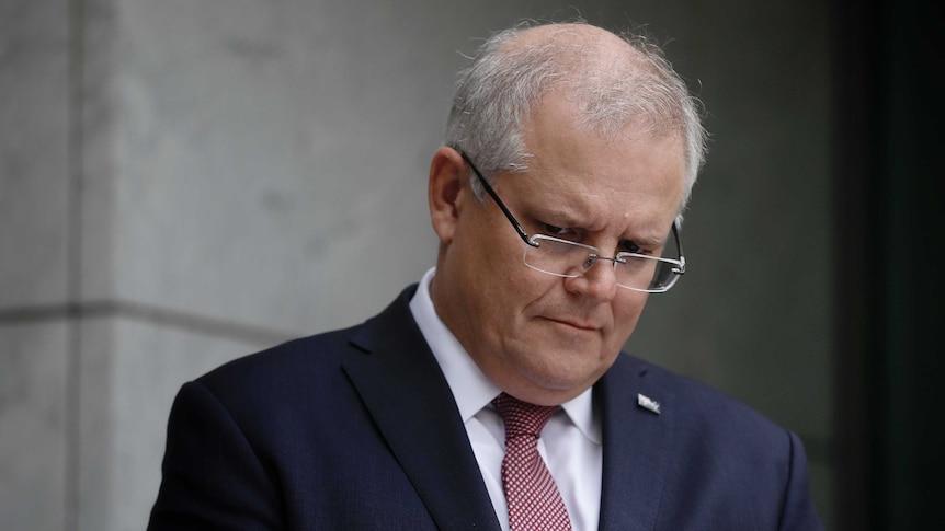 Morrison head down, eyes looking concerned.