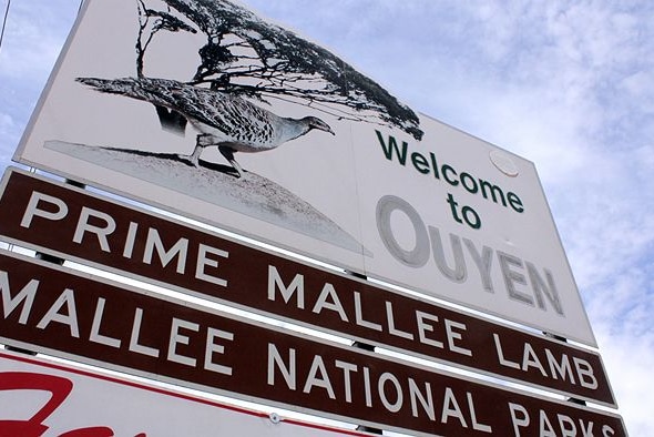 Sign saying Welcome to Ouyen, Prime Mallee Lam, Mallee National Parks, with a picture of a Mallee fowl.