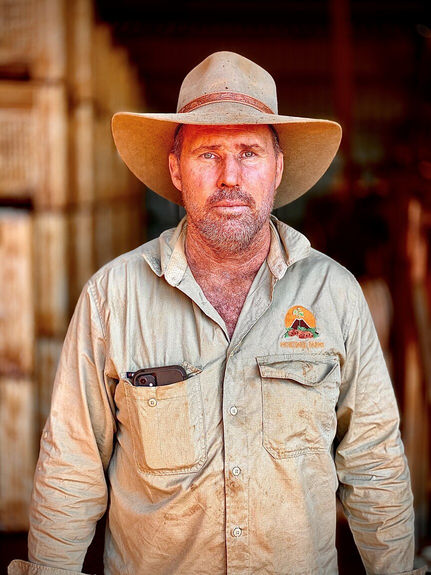 Bundaberg farmer Russell Mortimer wears a cowboy hat.