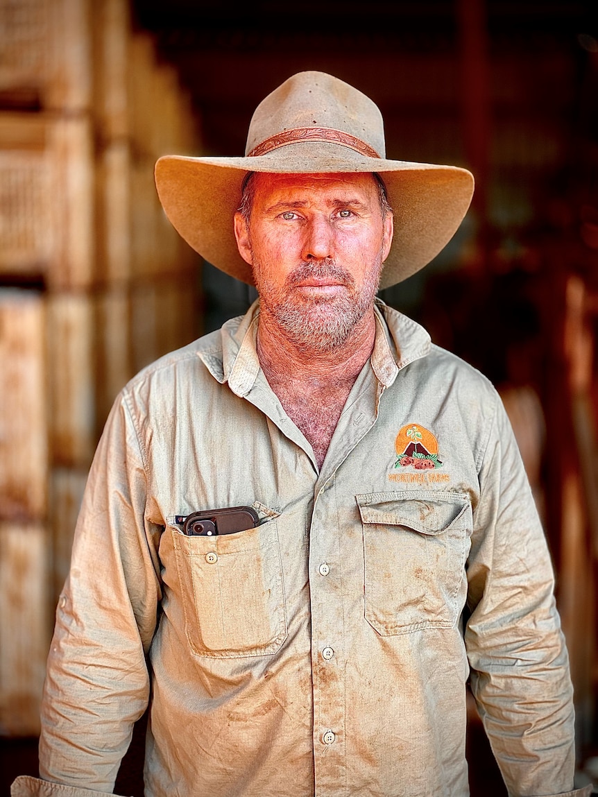 Bundaberg farmer Russell Mortimer wears a cowboy hat.