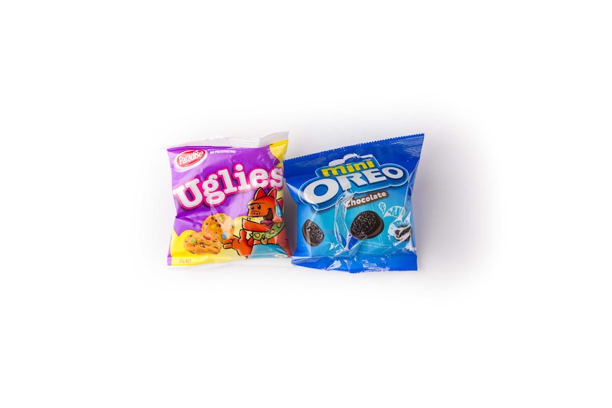 A photo of two small packets of biscuits, including Oreos and 'Uglies'.