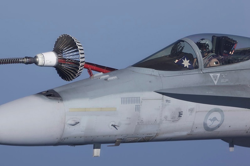 An FA-18A Hornet from Australia's Air Task Group refuels from a Royal Australian Air Force KC-30A Multi Role Tanker Transport aircraft