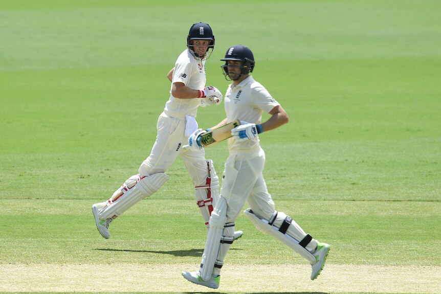 England batsmen Joe Root and Dawid Malan run between wickets on day 3 of the Ashes Test