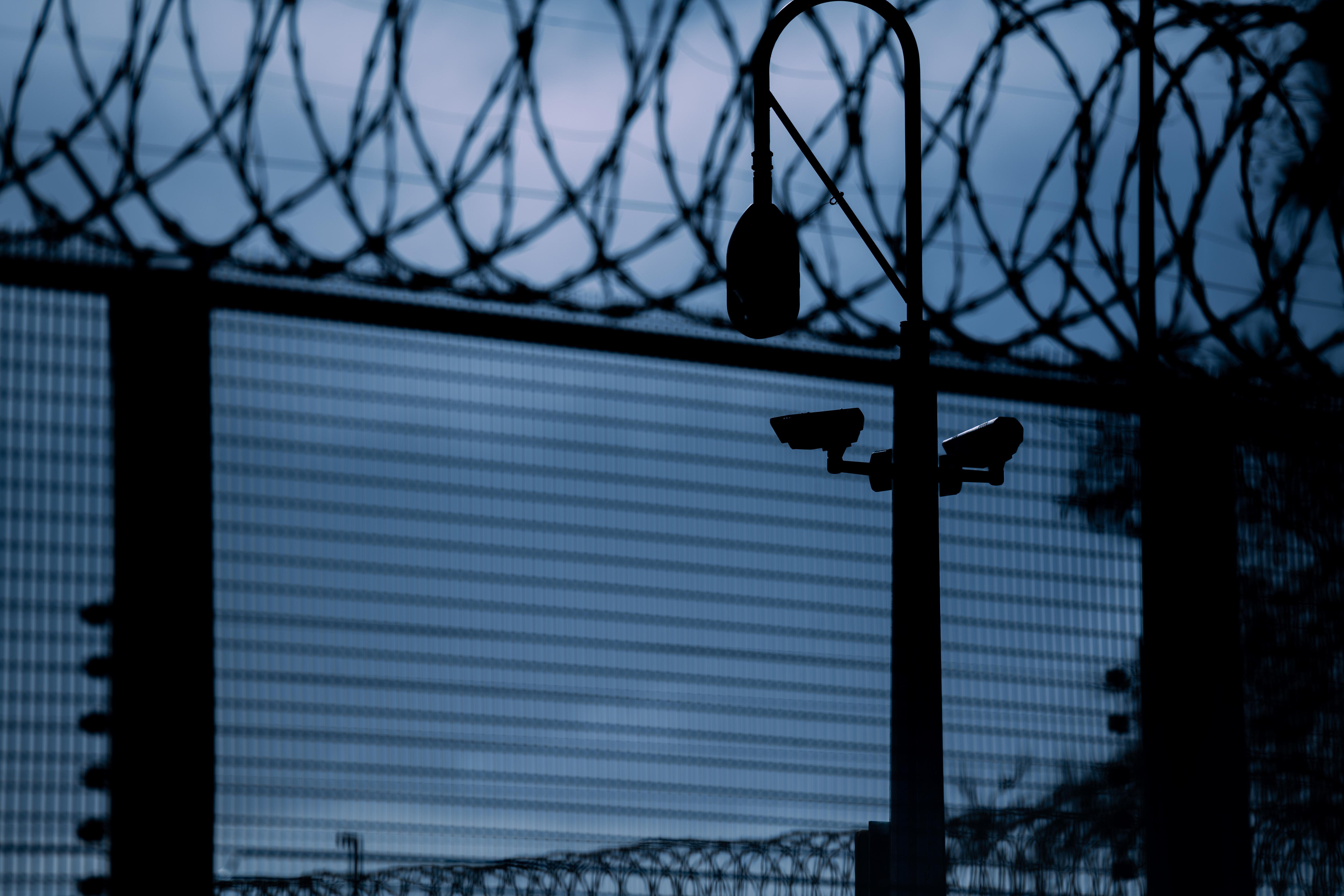 A prison fence and security camera