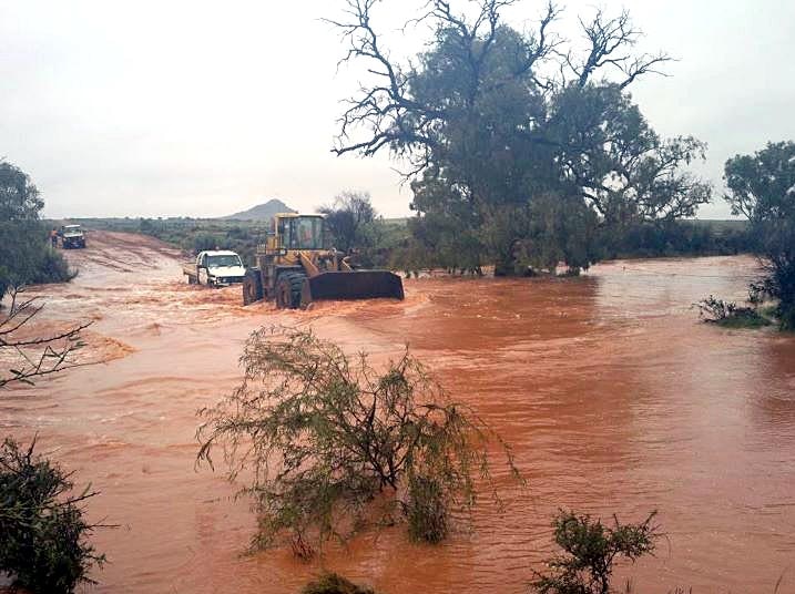 A dozer makes its way through floodwaters at Broken Hill.