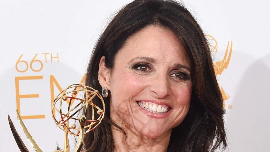 Julia Louis-Dreyfus poses with her award for Outstanding Lead Actress in a Comedy Series for Veep at the Emmys.