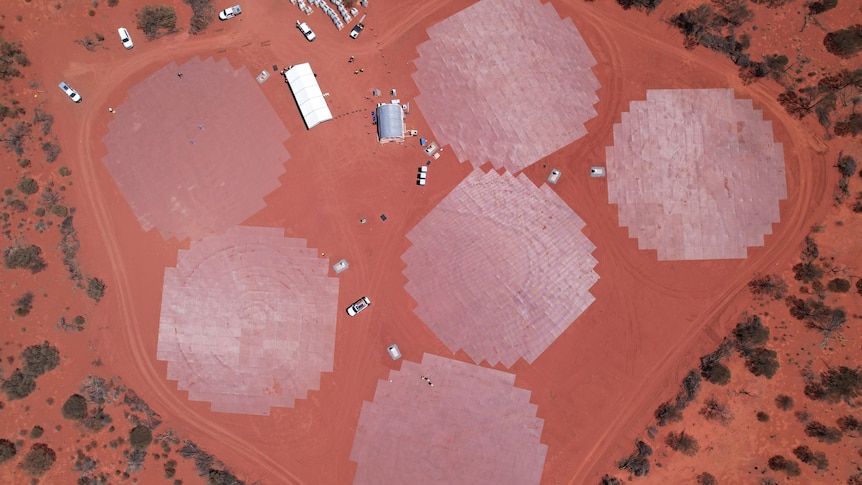 An aerial drone shot of a facility being built in the WA outback, with lots of red dirt surrounding. 