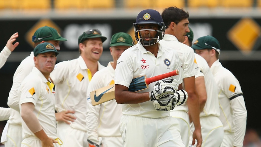 Australia celebrates the wicket of Ravichandran Ashwin on day four of the second Test between Australia and India at the Gabba