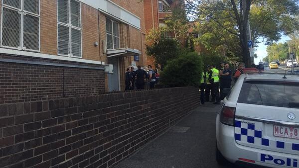 Witnesses said heavily-armed police were perched on roof in South Yarra.